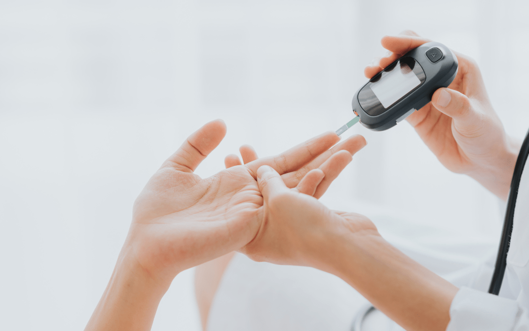 Doctor checking blood sugar levels on patient’s finger