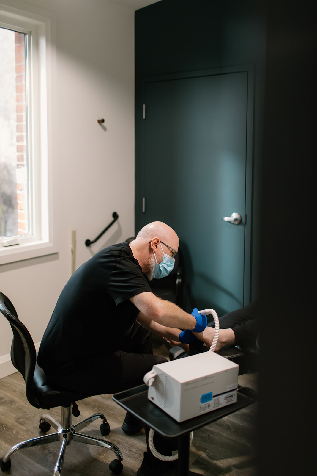 Chiropodist at The Foot Health Centre reducing nail thickness